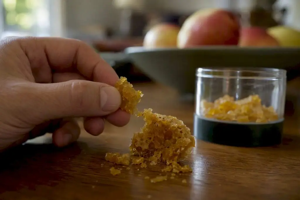 Close-up of cannabis crumble texture breaking