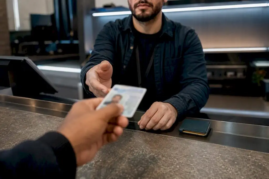 Customer presenting photo ID at dispensary